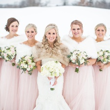 Bride and bridesmaids at a winter wedding reception at Hazeltine National Golf Club