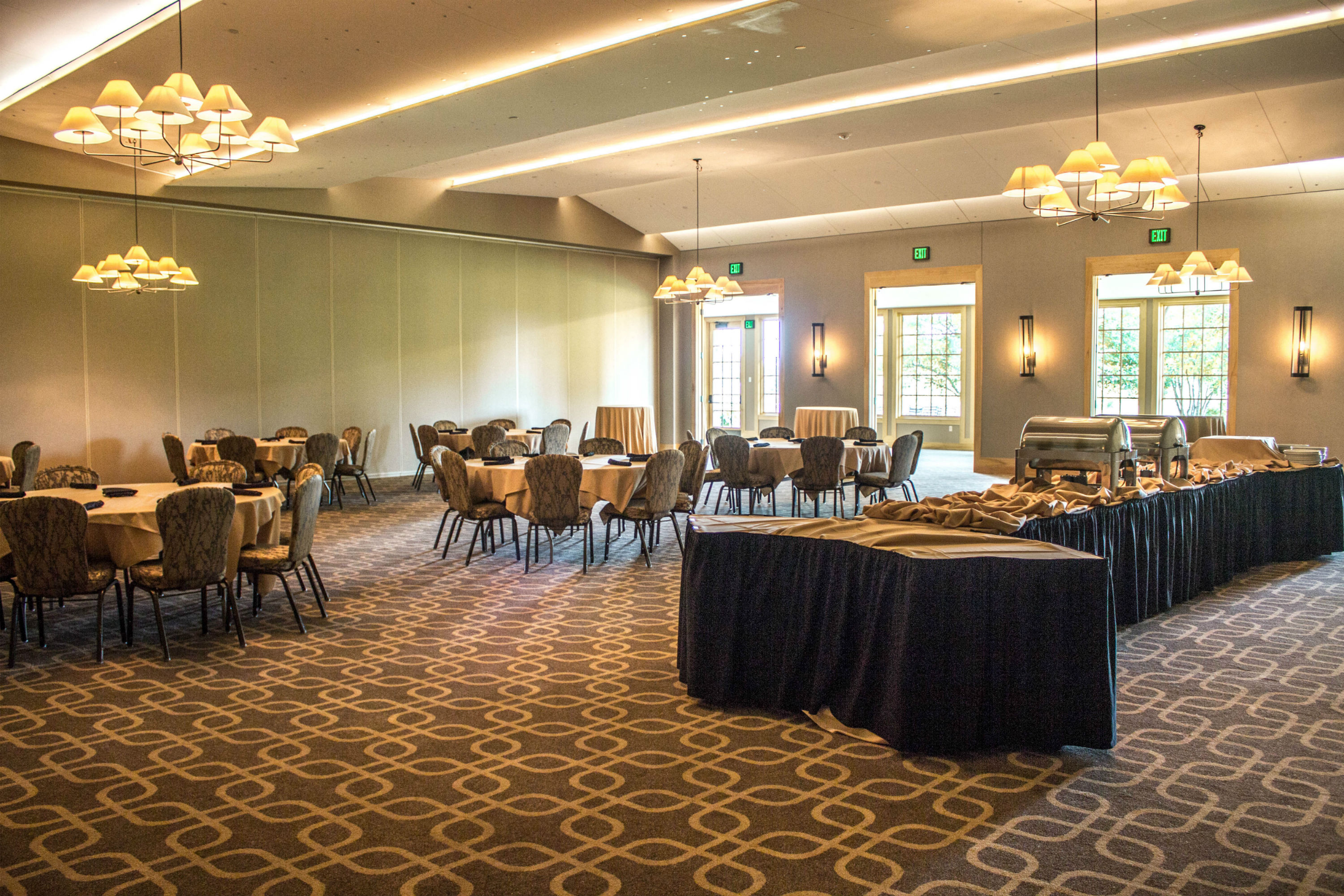 A team banquet at Hazeltine National Golf Club with views of the golf course