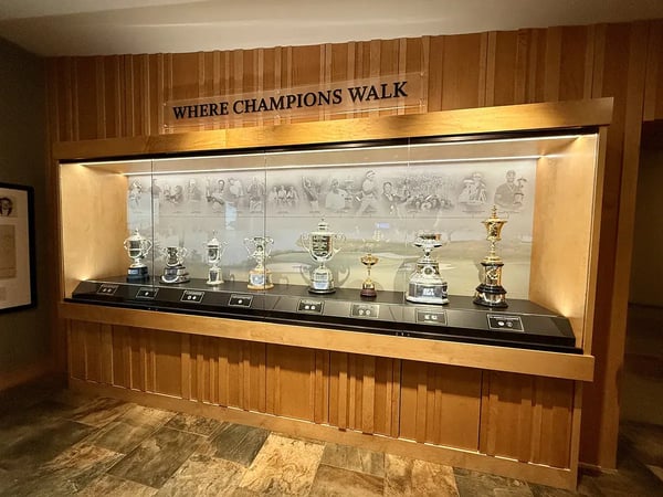 heritage hall trophy case with 8 trophies displayed