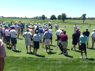 Golfers listen to rules before a private golf tournament at Hazelitne National Golf Club