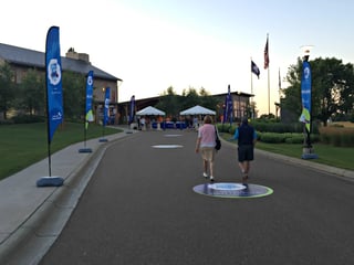 Players arrive at dawn for a private golf tournament at Hazeltine National Golf Club