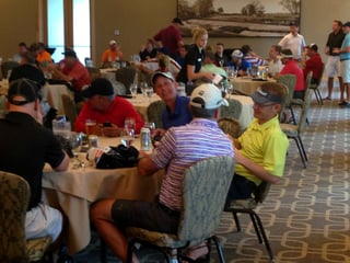 Golfers enjoy dinner after competing in a private golf tournament at Hazelitne National Golf Club