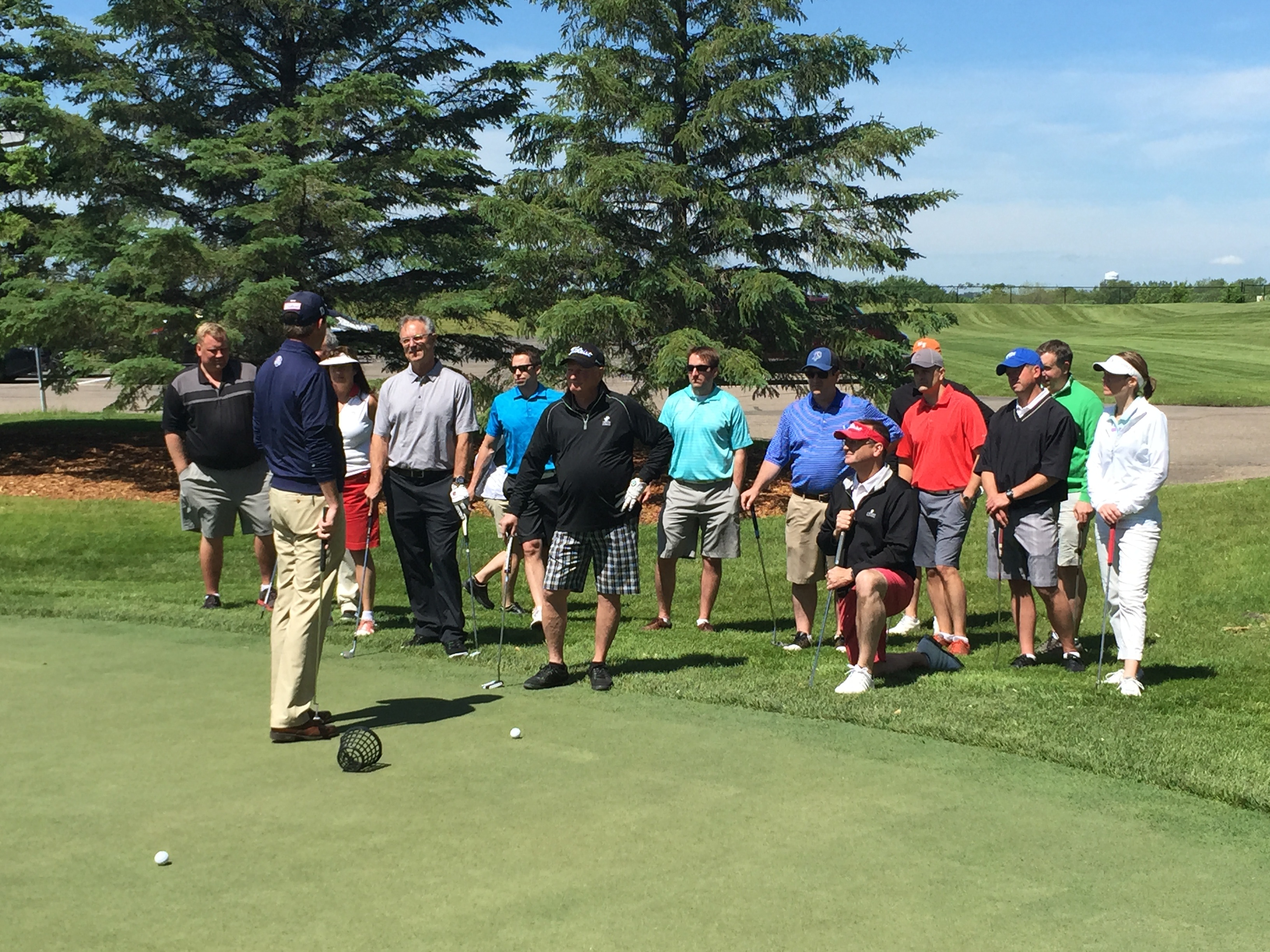Golfers at a golf clinic at Hazeltine National Golf Club