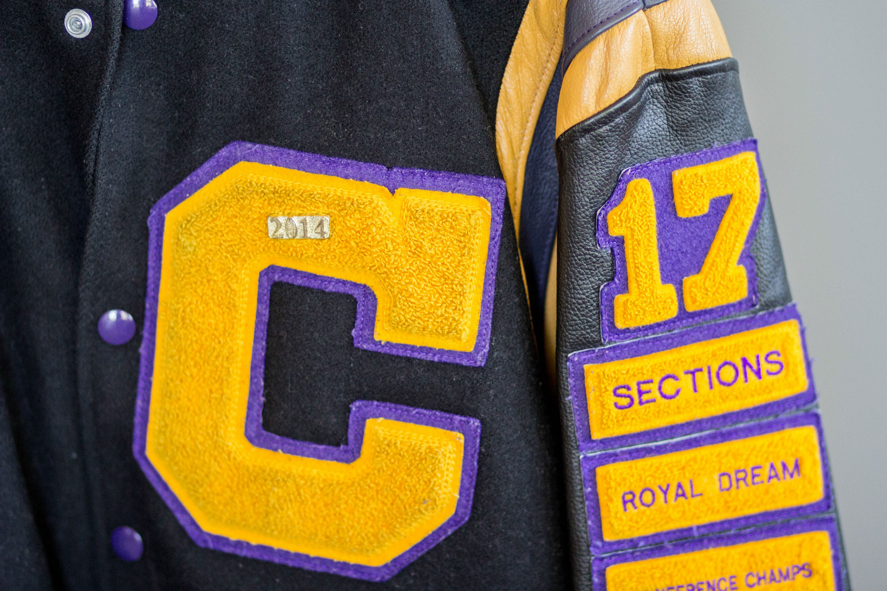 A high school letter jacket is used as decor for a sports banquet at Hazeltine National Golf Club