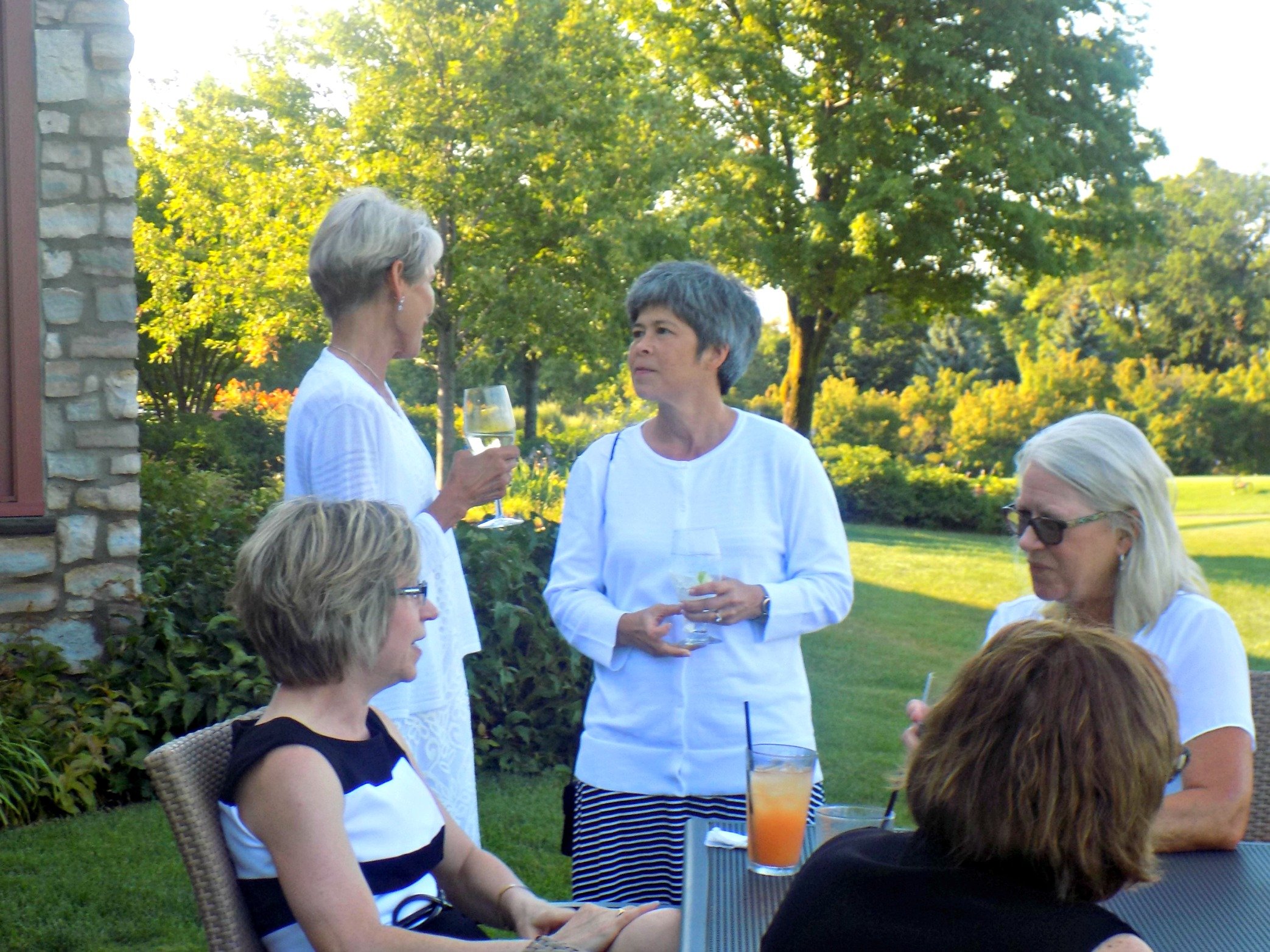 Business women networking after a Links and Drinks golf clinic at Hazeltine National Golf Club