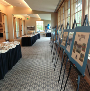 Pictures of the team and players decorate the room for a team banquet at Hazeltine National Golf Club